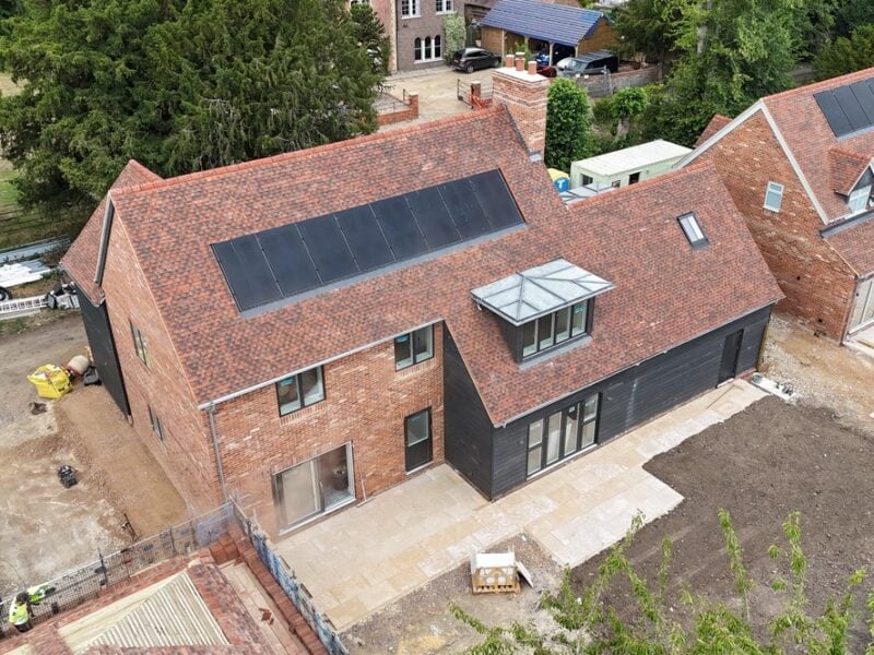 Flat roof membrane with solar array by AM Roofing Services